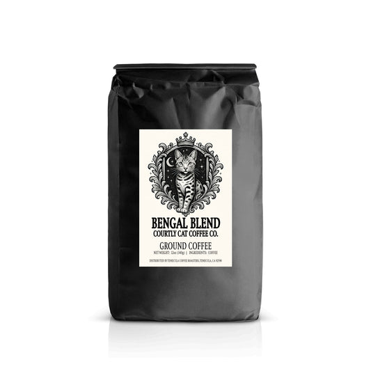 Black coffee bag featuring a regal Bengal cat in a celestial coat of arms style with crown illustration.